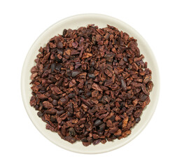 top view flat lay cacao cocoa nib in bowl isolated on white background.