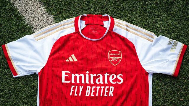 Thailand - June 2024: Adidas is launch Arsenal FC home jersey kit for season 2023-24 in red and golden striped, that inspirated from 20y anniversary of the invincible champion season (2003-04). 
