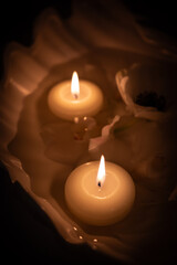 the burning candle on a  table