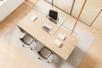 Top view of ceo room interior with workplace, armchairs and laptop