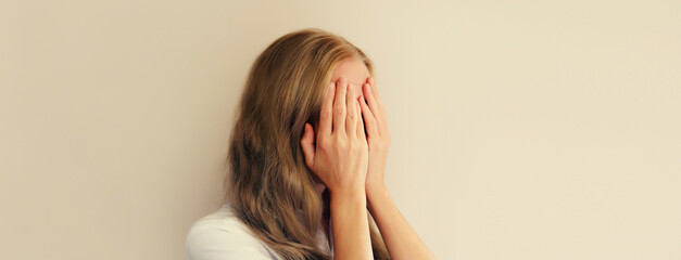 Fototapeta premium Upset sad crying woman experiencing mental or physical suffering