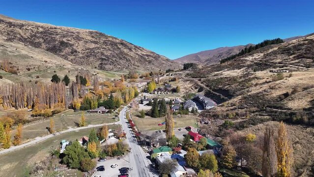 Cardrona small settlement and tourist spot in mountain valley. Sunny Autumn day in New Zealand.