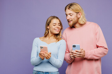 Young happy couple two friends family man woman wear pink blue casual clothes together hold in hand...