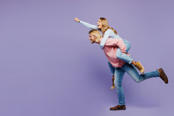 Full body young couple two friend family man woman wear pink blue casual clothes together giving...