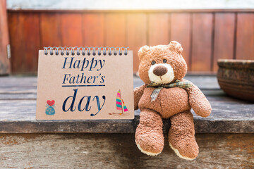 Father's day card background idea, Happy Father's day card with brown teddy bear sitting on wooden...