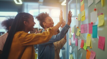 A diverse team collaborating on project strategies using sticky notes on a board