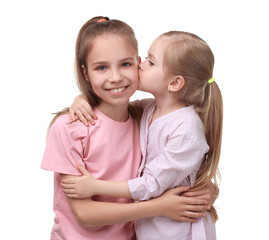 Portrait of cute little sisters on white background