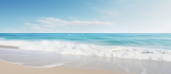 Scenic ocean coast with a sunny beach and white sand, perfect for vacation postcards with copy space image.