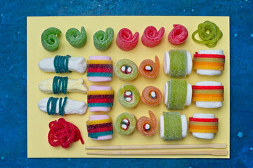 Various jelly strips, candies and marshmallows arranged to look like sushi