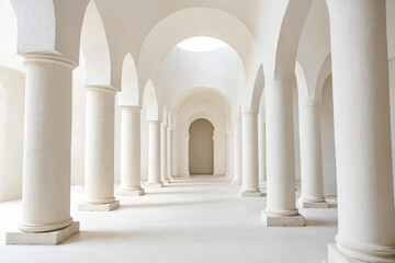 White pillars in an arched hallway