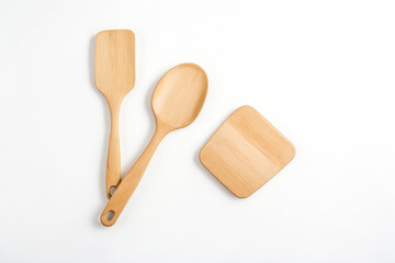 Wooden kitchen utensils on white background