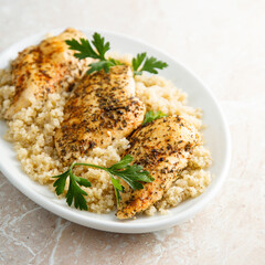 Baked chicken fillet with quinoa and herbs