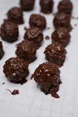 Delicious homemade sweet balls with dark and white chocolate.