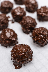 Delicious homemade sweet balls with dark and white chocolate.