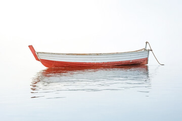 Small Wooden Rowboat Floating On Calm Water