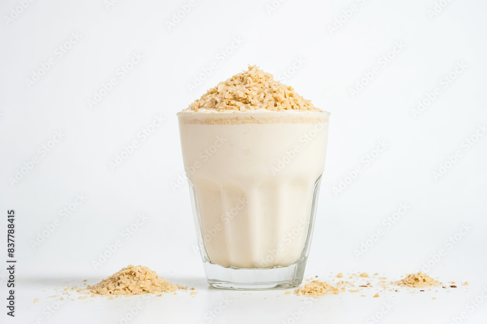 Canvas Prints Oat milk in a glass with oat flakes on top