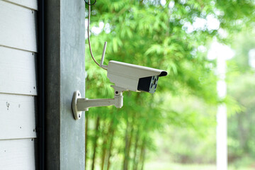 CCTV monitoring the building for the safety of the property and inspecting people entering and exiting the building. Soft and selective focus.