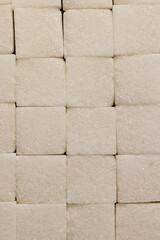 white square sugar on a black background