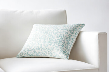 White Sofa with Blue Floral Pillow