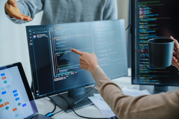 asian and Indian Developer team discussion feedback analysis coding data with software computer at office