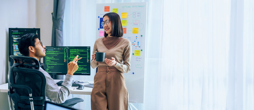 Two software developers engage in a discussion at coffee break time in a modern office, relax emotion