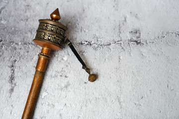 old prayer wheel or mani wheel with tibet mantra language made from copper and wood for Tibetan...