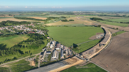 Drone aerial highway in construction Czech Prerov, destruction of agricultural land fields village, remove of people houses and buildings land grabbing extension works additional lanes way new road