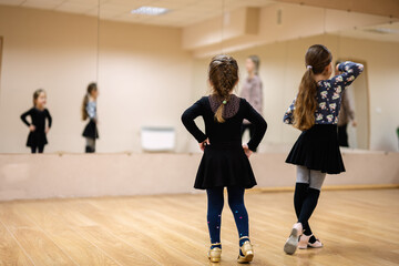 Young Girls at Dance Class Practicing Ballet and Dance Moves in Studio