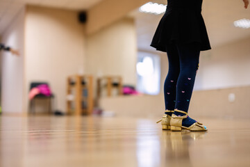 Close-Up of a Young Girl in Tap Dancing Shoes in a Dance Studio