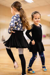 Two Adorable Little Girls Dancing Together in a Dance Studio