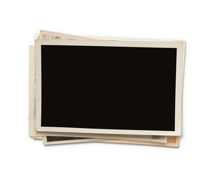 Stack of old photos isolated on transparent background, png file. Clipping path for the inside of the photo included