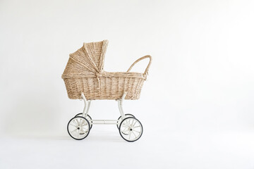 Wicker Baby Carriage On White Background