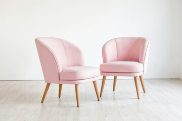 Two Pink Velvet Armchairs in a White Room