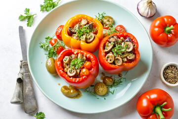 Stuffed Bell Peppers with Mushrooms and Olives on a Green Plate