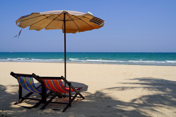 beach chairs and umbrella on the beach