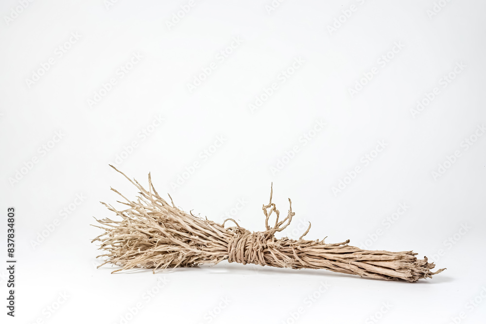 Wall mural Dry Bundle of Twigs on White Background