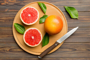 fresh Fruit grapefruit slices on colored background. Top view. Copy Space. creative summer concept. Half of citrus in minimal flat lay with copy space