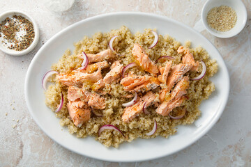 Hot smoked salmon with quinoa and red onion
