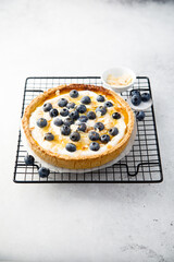 Homemade pumpkin pie with mango, blueberry and honey