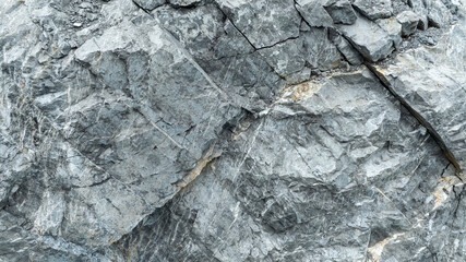cracked black stone surface texture background.
