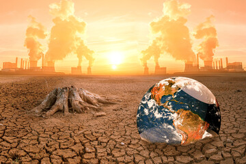 Global Warming Concept with Earth and Deforestation in a Dry, Polluted Landscape with Industrial...