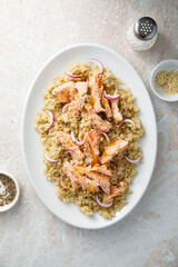 Hot smoked salmon with quinoa and red onion
