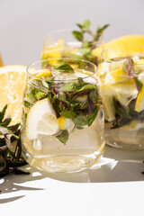 A glass of refreshing lemon water with mint
