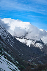 Norwegian landscape. The road leads through a mountain gorge that descends, glacier