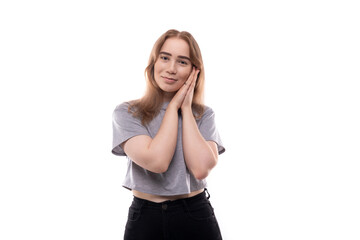 Fototapeta premium Cute teenage girl with blond hair on a white background