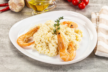 Italian risotto with prawn served thyme