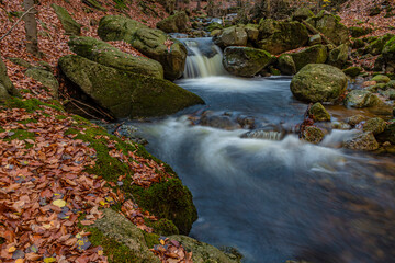 cascades on forest creek on autumn in Jizerske hory
