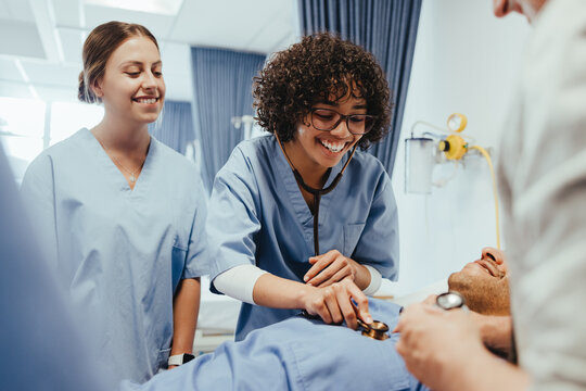 Students of medicine learn how to use a stethoscope in a hospital