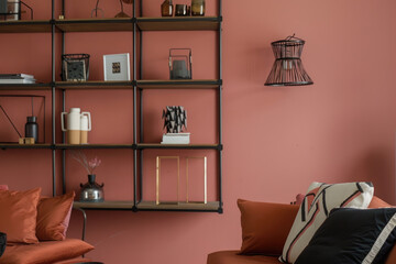 A living room with a red wall and white furniture