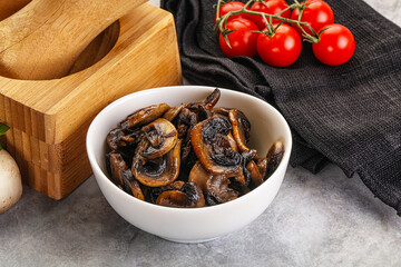 Roasted champignon mushrooms in the bowl